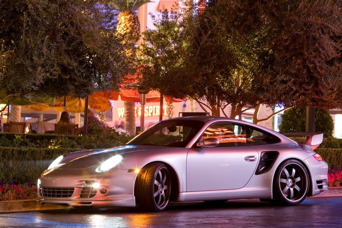 Silver Porsche 911 Turbo S parked at night