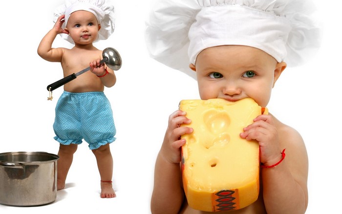 Baby chef eating a large block of cheese