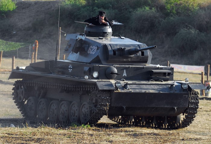 German Panzer IV tank with crew member