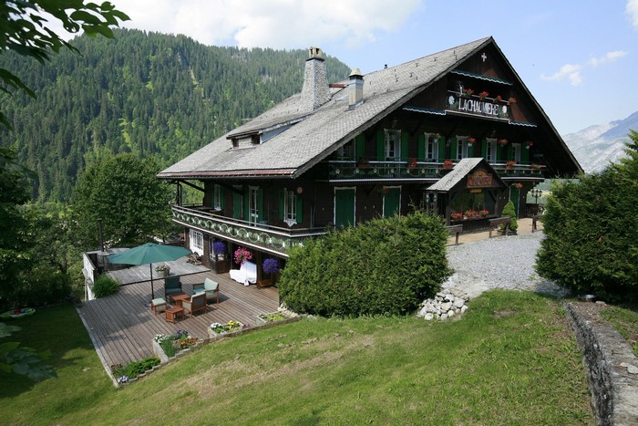 Chalet in the Swiss Alps with Mountain Backdrop