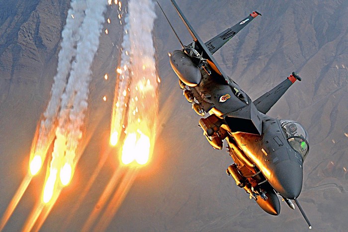 F-15 Eagle fighter jet deploying flares