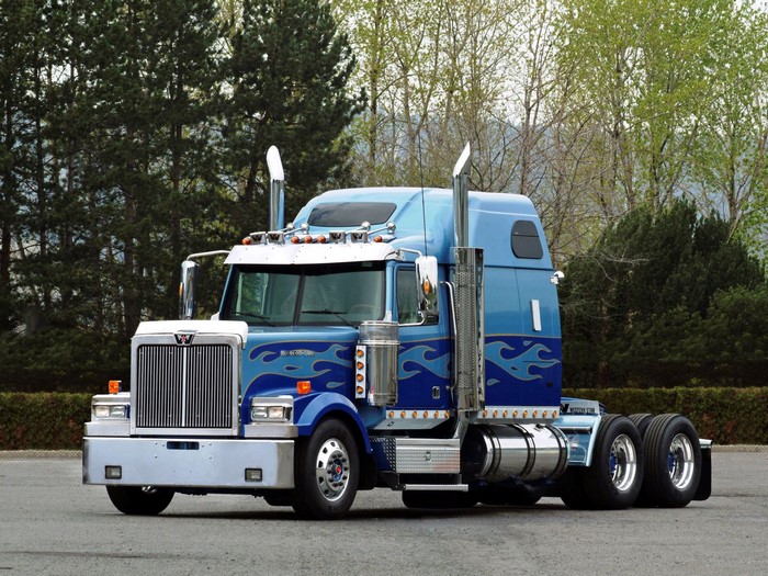 Blue Western Star semi-truck with flame decals