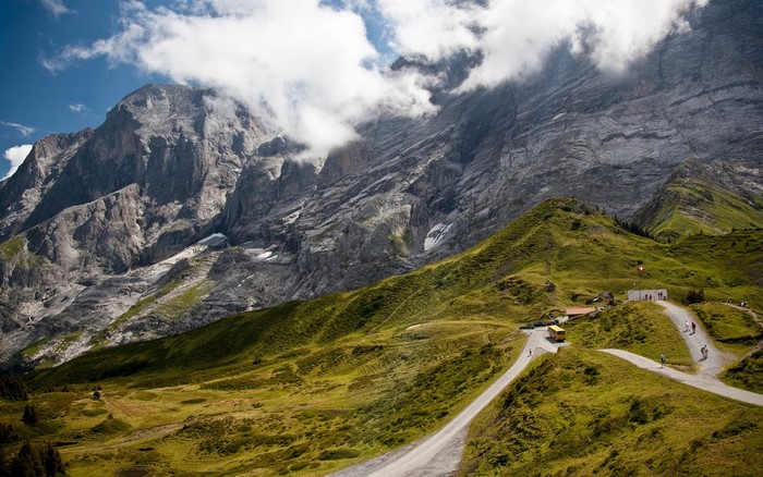 Mountain landscape with winding road and buildings