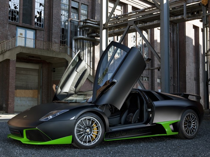 Matte black Lamborghini Murcielago with green accents and open doors