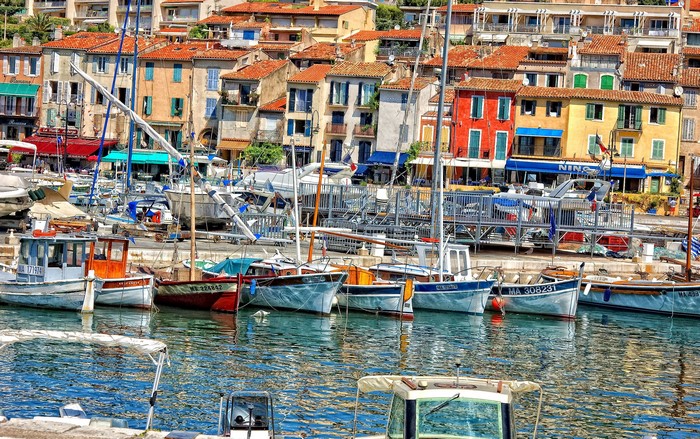 Boats docked in a colorful harbor in France