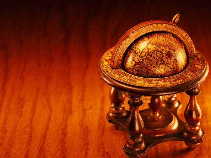 Antique globe on a wooden table