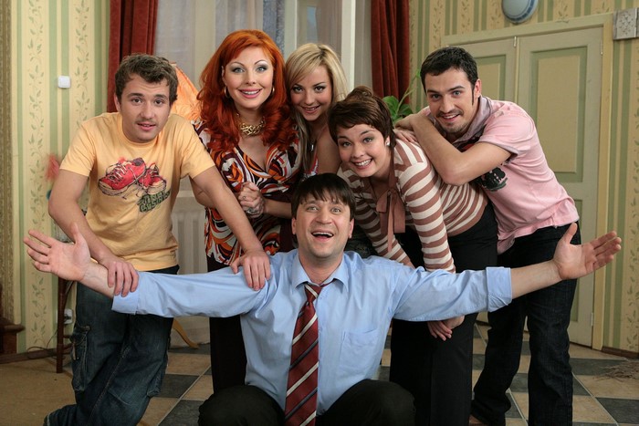 A group of six people posing for a photo