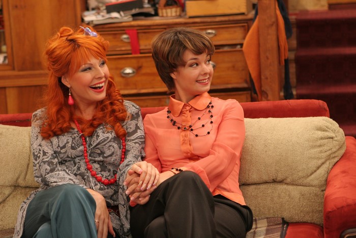 Two women sitting on a couch
