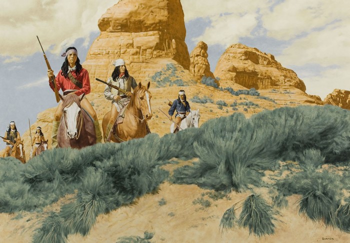 Native American riders in a desert landscape