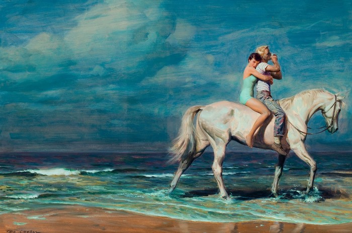 Couple riding a white horse on the beach