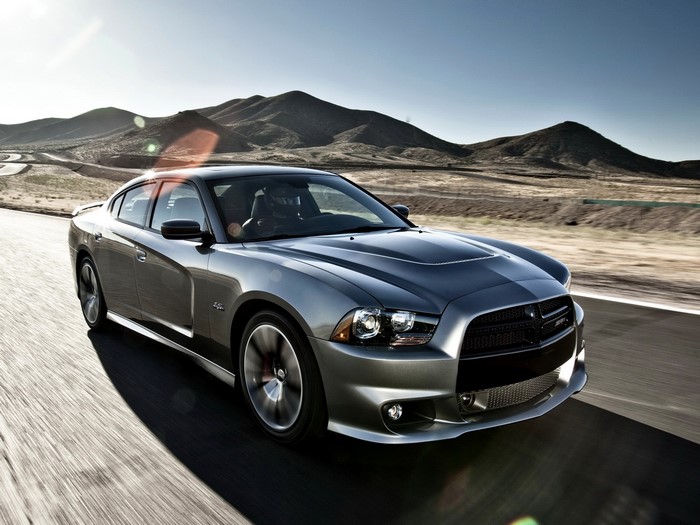 Silver Dodge Charger SRT driving on a desert road
