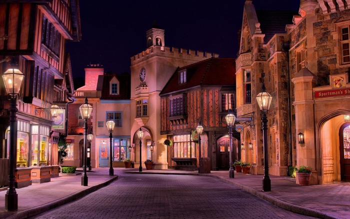 Nighttime street scene with European-style buildings and lampposts