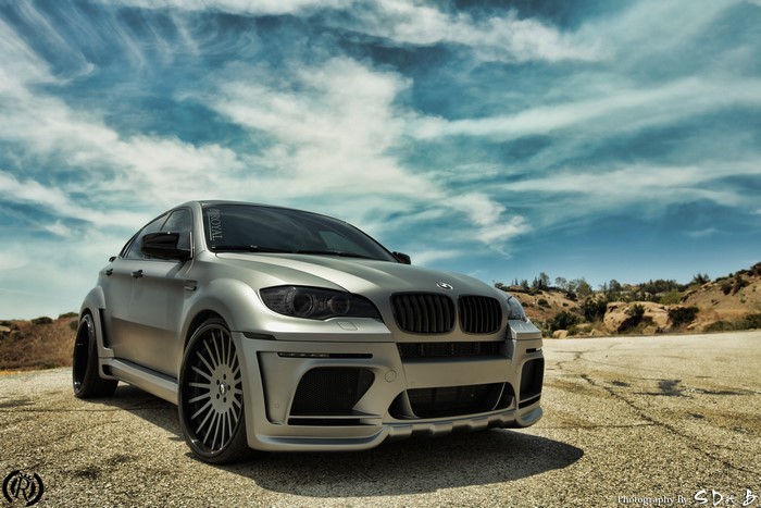 Silver BMW X6 M with custom body kit