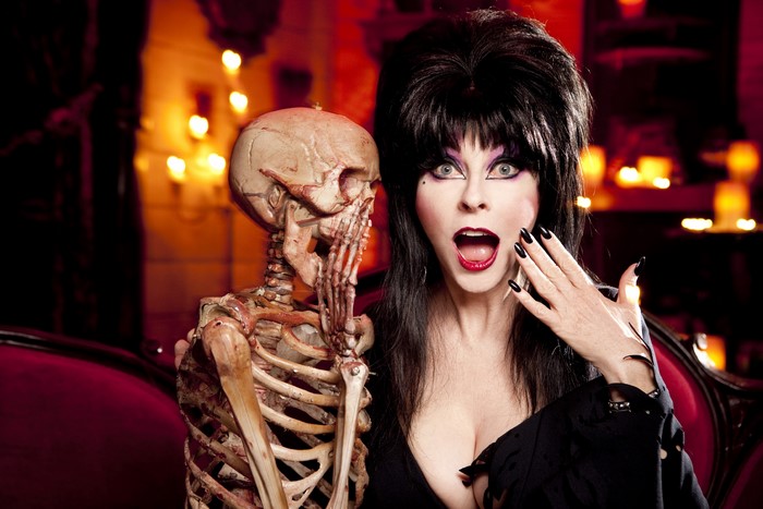 Elvira Mistress of the Dark with a skeleton