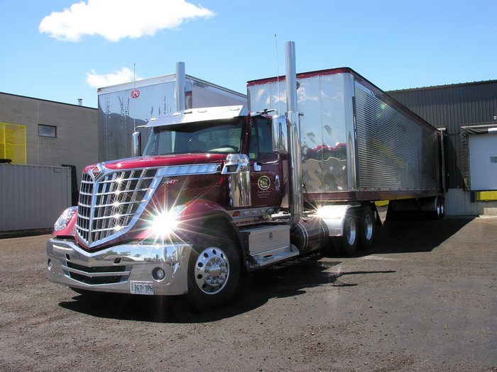 Red International Semi-Truck with Trailer at Loading Dock