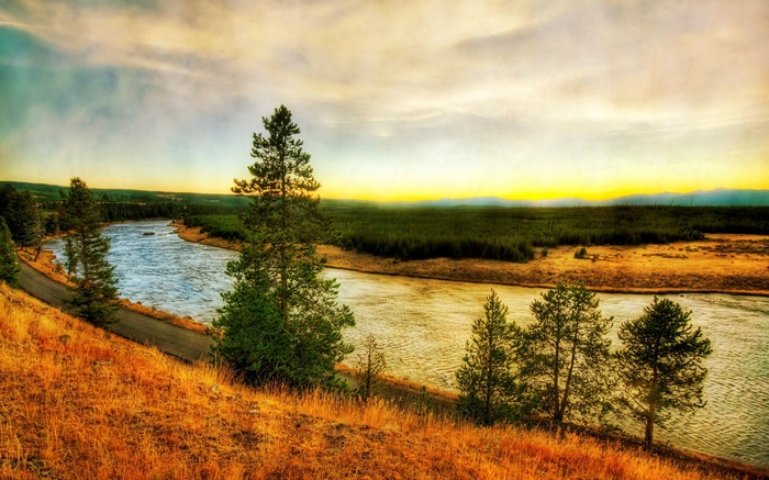 River flowing through a valley at sunset