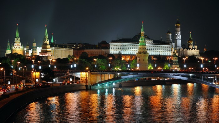 Moscow Kremlin at night with river and bridge