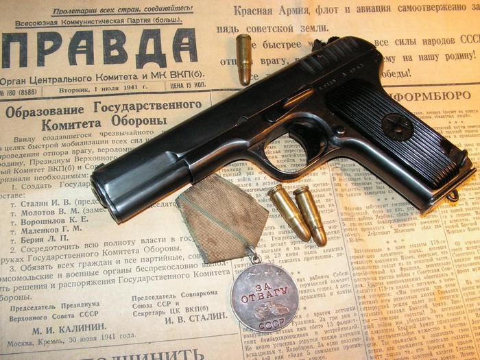 TT-33 pistol with medal and newspaper