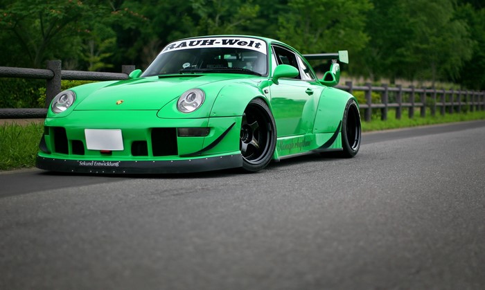 Green Porsche 911 RWB with large spoiler