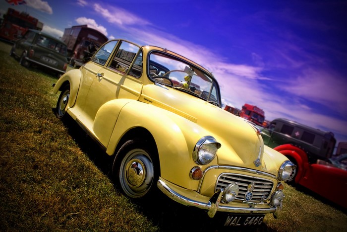 Yellow Morris Minor car at a car show
