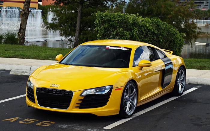 Yellow Audi R8 parked in a parking lot