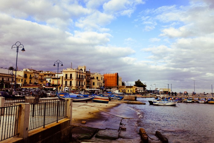 Boats docked in a harbor in Italy