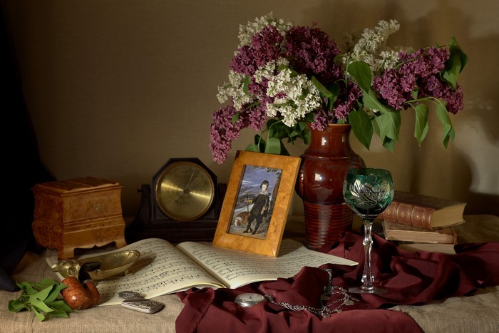 Still life with lilacs and personal items