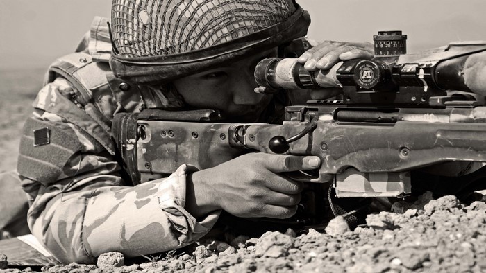 Soldier aiming a sniper rifle