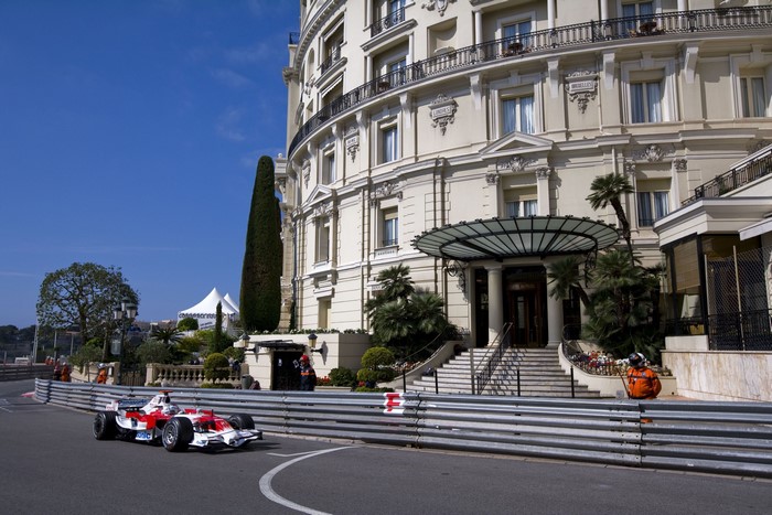Formula 1 car racing past the Hotel de Paris in Monaco