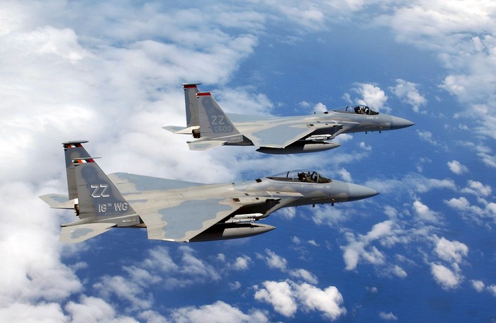Two F-15 Eagle fighter jets flying in formation