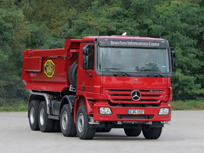 Red Mercedes-Benz Actros dump truck with Meiller logo