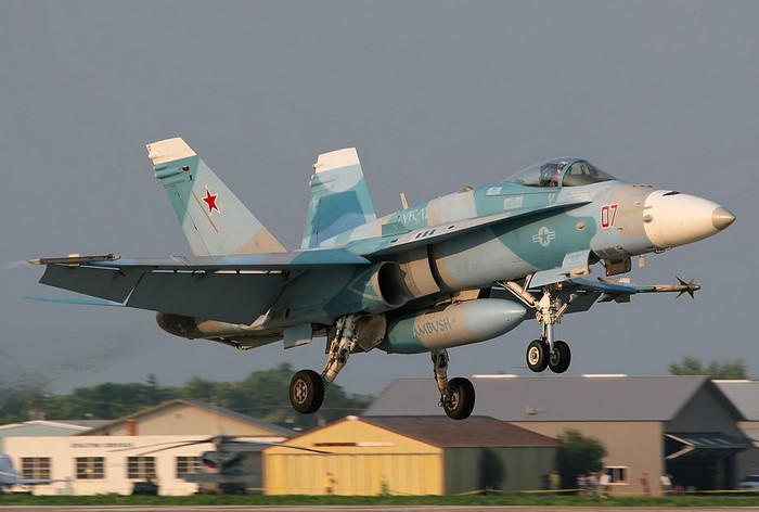 Fighter jet taking off with camouflage paint