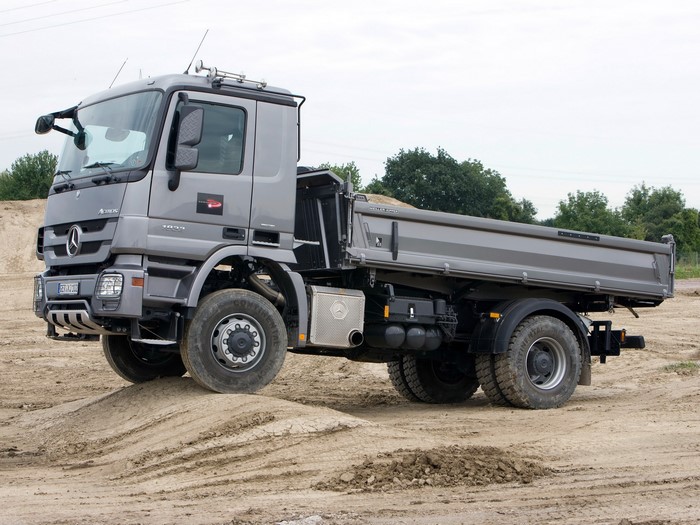 Mercedes-Benz dump truck on a dirt mound