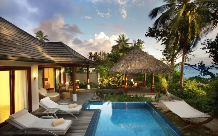 Tropical resort villa with private pool and hammock