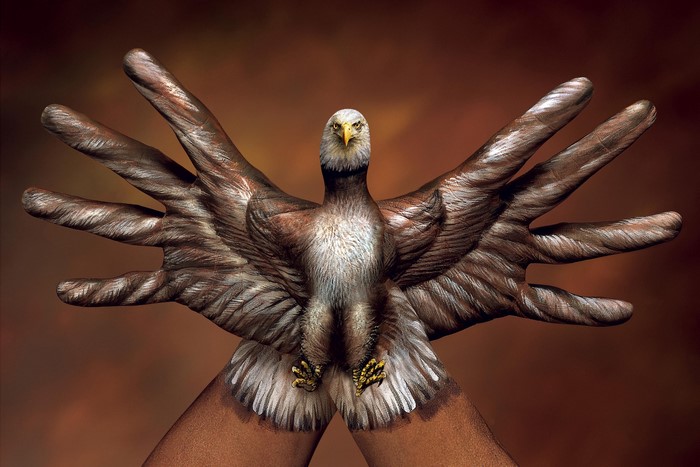 Eagle body paint on hands and arms