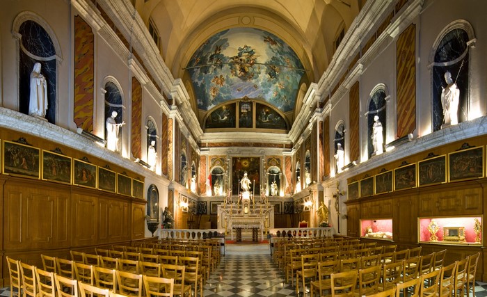 Interior of a church with religious statues and paintings