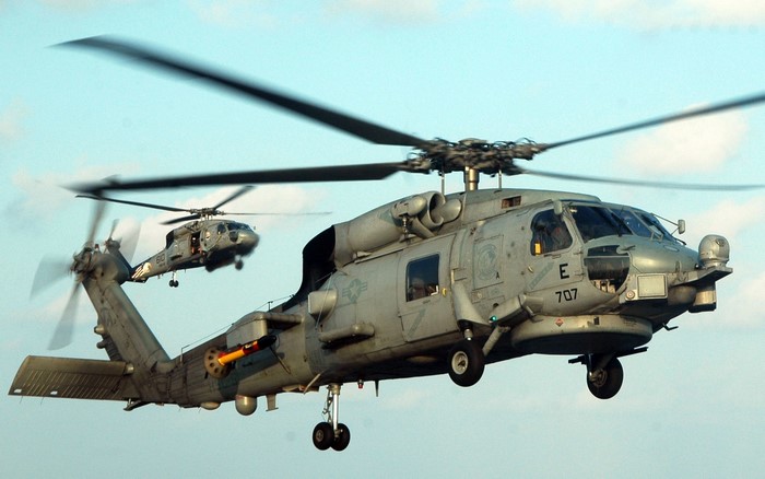 Two US Navy MH-60R Seahawk helicopters in flight