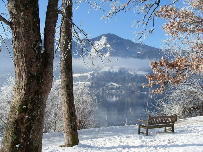 Winter scene with snow-covered mountains and a lake