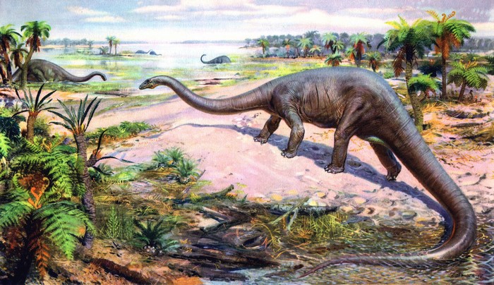 Dinosaurs in a prehistoric landscape