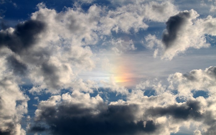 Sky with clouds and a rainbow