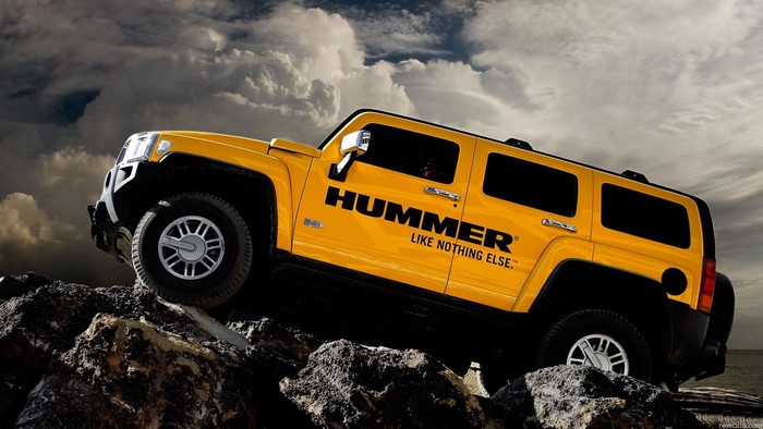 Yellow Hummer H3 Off-Roading on Rocks