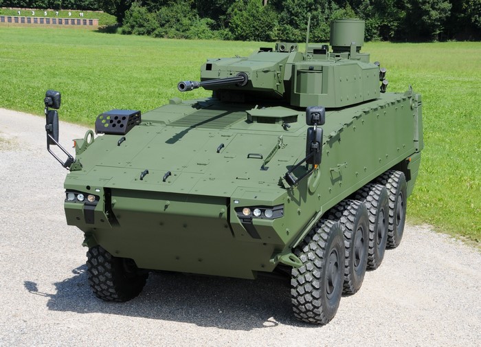Green armored personnel carrier with a turret