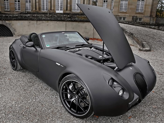 Matte black Wiesmann convertible with hood open