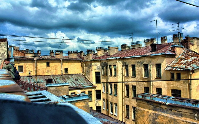 Rooftops and cloudy sky over old buildings