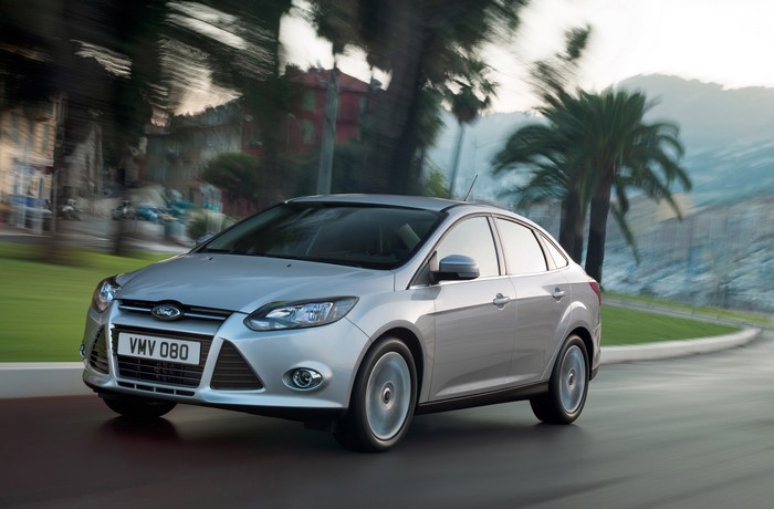 Silver Ford Focus Sedan Driving on Road