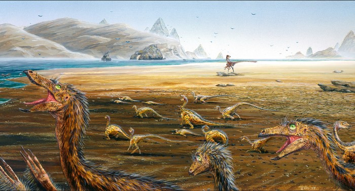 A group of dinosaurs on a beach with mountains in the background