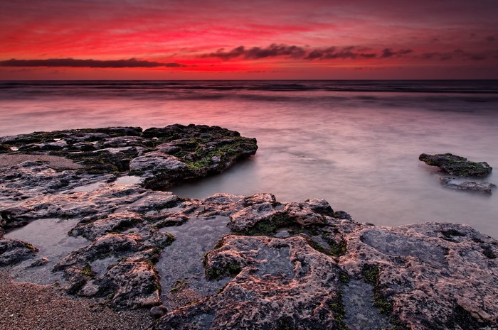 Rocky Shoreline During a Vibrant Sunset