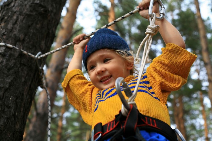 Young girl on a ropes course
