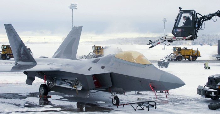 F-22 Raptor fighter jet in snowy conditions