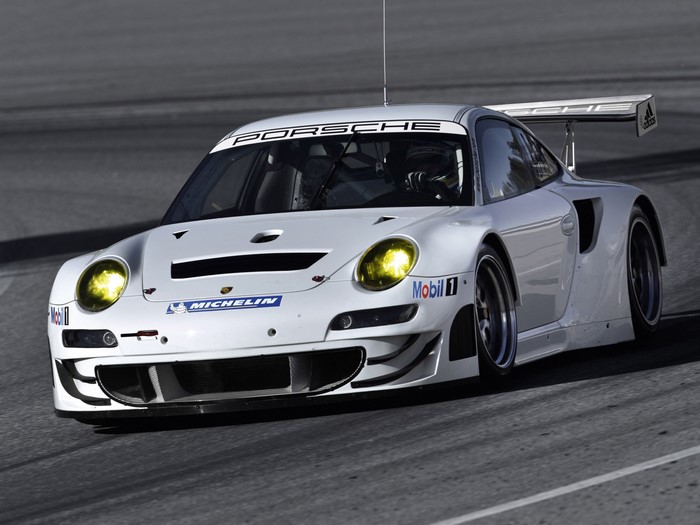 White Porsche 911 GT3 R race car on track